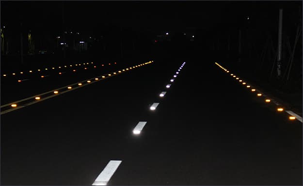 reflective road stud on road